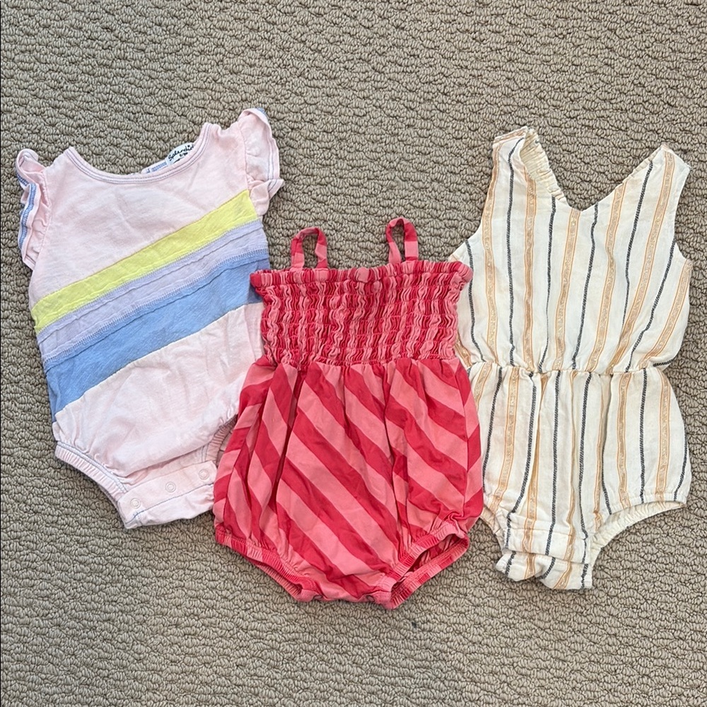 Set of Three Baby Rompers in Pink, Red, and Cream